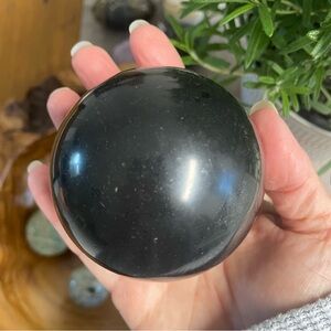 Black tourmaline crystal carved sphere